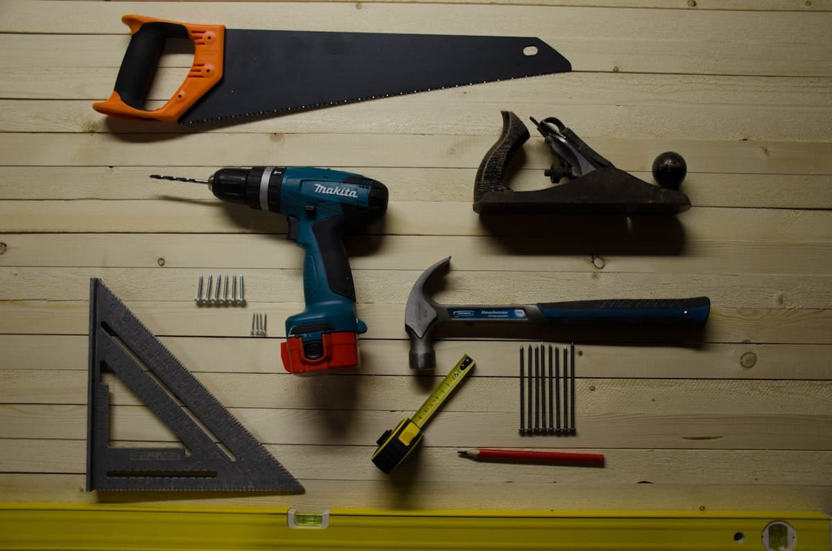Hand tools laid out on a workbench